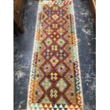 TWO ORIENTAL TRIBAL FLAT WEAVE RUGS.