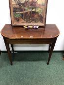 A GEORGE III MAHOGANY FOLD OVER CARD TABLE.