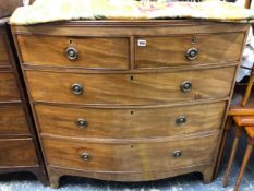 A REGENCY MAHOGANY BOW FRONT CHEST OF DRAWERS.