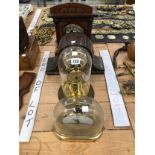 FOUR VARIOUS MANTEL CLOCKS, TWO BEING UNDER GLASS DOMES