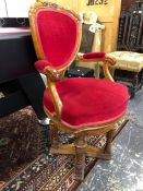 AN UNUSUAL WALNUT CARVED SHOW FRAME VICTORIAN SWIVEL ARMCHAIR.