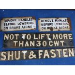 TWO ENAMEL RAILWAY SIGNS INSCRIBED REMOVE HANDLES BEFORE LOWERING ON BRAKE ALONE TOGETHER WITH TWO