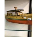 A TIN PLATE MODEL OF A STEAM BOAT