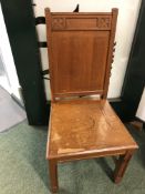 A PAIR OF GOTHIC STYLE OAK HALL CHAIRS.