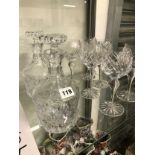 A PAIR OF CUT GLASS DECANTERS AND SIX WINE GLASSES EN SUITE