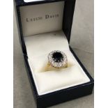 A 9ct GOLD HALLMARKED SAPPHIRE AND CUBIC ZIRCONIA LARGE CLUSTER RING. FINGER SIZE Q. WEIGHT 4.