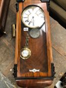 A VICTORIAN WALNUT CASED WALL CLOCK AND ONE OTHER.