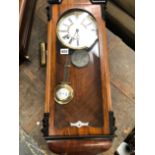 A VICTORIAN WALNUT CASED WALL CLOCK AND ONE OTHER.