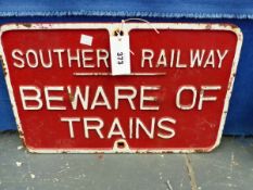 A SOUTHERN RAILWAY RED GROUND IRON SIGN BEWARE OF THE TRAINS