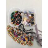 A QUANTITY OF COSTUME JEWELLERY TO INCLUDE BROOCHES BEADS, EARRINGS ETC.