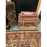 A LEATHER SUITCASE, A TRUNK AND A FOLDING CAKE STAND.