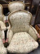 A PAIR OF FRENCH GILT SHOW FRAME ARM CHAIRS.
