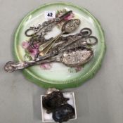 A PAIR OF RETAILED HARRODS SILVER PLATED BERRY SPOONS, THREE PAIRS OF GRAPE SCISSORS, A HALLMARKED