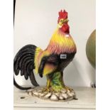 A COLOURFUL POTTERY COCKEREL. H 50cms.