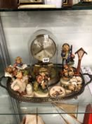 A JUNGHANS ELECTRIC CLOCK TOGETHER WITH HUMMEL FIGURES ON AN ELECTROPLATE OVAL TRAY