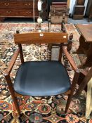 A MID CENTURY TEAK ARMCHAIR.