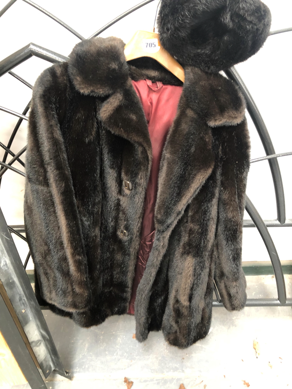 A TISSAVEL OF FRANCE FUR COAT AND AN ASSOCIATED HAT.