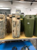 TWELVE VARIOUS METAL AND PLASTIC JERRY CANS.