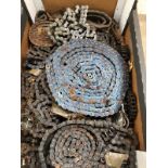 A BOX OF MOTORCYCLE DRIVE CHAINS ETC.