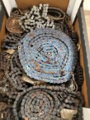 A BOX OF MOTORCYCLE DRIVE CHAINS ETC.