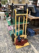 A SACK TRUCK AND TWO BENCH VICE.
