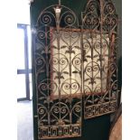 A PAIR OF ANTIQUE WROUGHT IRON WINDOW GRILLS.