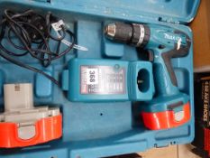 A MAKITA POWER DRILL.