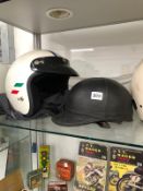 FOUR VINTAGE MOTORCYCLE HELMETS FOR ORNAMENTAL USE ONLY.