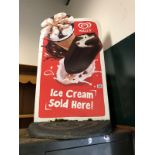 A VINTAGE ICE CREAM SIGN.