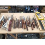 A COLLECTION OF LARGE WOOD TURNING CHISELS ETC.