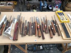 A COLLECTION OF LARGE WOOD TURNING CHISELS ETC.