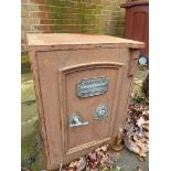 AN ANTIQUE IRON SAFE WITH BRASS FITTINGS COMPLETE WITH KEYS