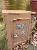 AN ANTIQUE IRON SAFE WITH BRASS FITTINGS COMPLETE WITH KEYS