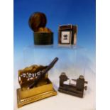 A GREEN LEATHER MOUNTED BRASS INKWELL, A CHROME INKWELL, A PROPELLING PENCIL, A BRASS POSTAGE