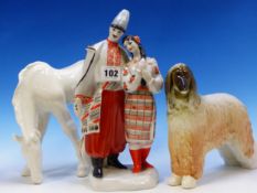 A RUSSIAN PORCELAIN GROUP OF A COSSACK AND GIRL, A LOMONOSOV HORSE AND A SELUKI