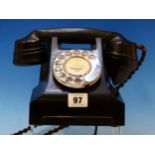 A BLACK BAKELITE TELEPHONE