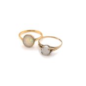 AN 18ct STAMPED OPAL RUBOVER SET RING. UNHALLMARKED AND ASSESSED AS 18ct. FINGER SIZE M 1/2,