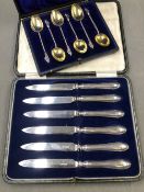A SET OF SIX HALLMARKED SILVER APOSTLE SPOONS WITH GILDED BOWLS IN A FITTED CASE, TOGETHER WITH A