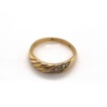 A VINTAGE CUBIC ZIRCONIA DRESS RING WITH REEDED TEXTURED BAND. STAMPED 585 ASSESSED AS 14ct GOLD