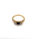 AN 18ct YELLOW GOLD SAPPHIRE AND DIAMOND THREE STONE DRESS RING. FINGER SIZE O 1/2 WEIGHT 2.5grms