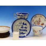 A CHINESE EXPORT TEA BOWL AND SAUCER, A FAMILLE ROSE SAUCERS, A LATER BLUE AND WHITE CUP AND