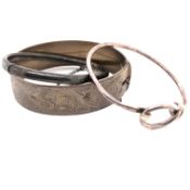 A HALLMARKED SILVER HEAVY SOLID HINGED BANGLE, HALF ENGRAVED. DATED 1960, LONDON, TOGETHER WITH A