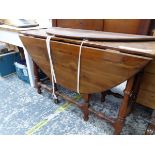 AN INTERESTING BURMUDAN YEW OR FRIUT WOOD DROP LEAF TABLE.