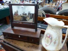 A GEORGIAN SWING MIRROR AND A WASH JUG.