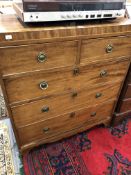 A 19th C. LINE INLAID AND CROSS BANDED MAHOGANY CHEST OF TWO SHORT AND THREE GRADUATED LONG DRAWERS.