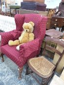 A WINGBACK ARMCHAIR AND A BEDROOM CHAIR.