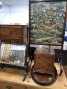 AN OAK BEDSIDE CUPBOARD, A MINIATURE MAHOGANY CHEST OF THREE DRAWERS, A FIRE SCREEN NEEDLE WORKED