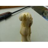 AN ANTIQUE CARVED IVORY FIGURE OF AN IMMORTAL WITH SIGNATURE TABLET TRANSLATING JUROJIN.