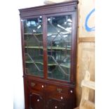 A GEORGE III MAHOGANY GLAZED CORNER CABINET.