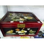 A CHINESE LACQUER BOX INLAID WITH SEMI PRECIOUS STONE FLOWERS AND BIRDS.